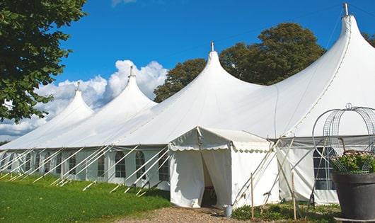 a line of sleek and modern portable toilets ready for use at an upscale corporate event in Scooba MS